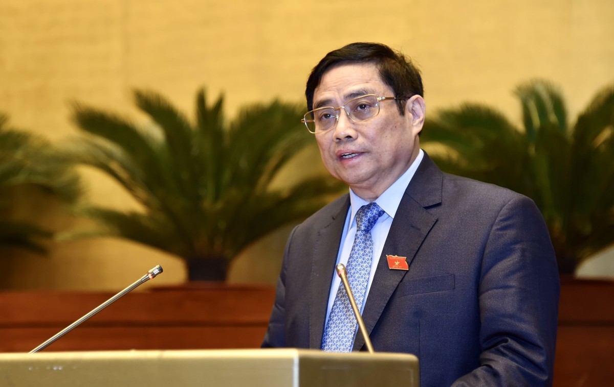 Thủ tướng Phạm Minh Chính trình bày báo cáo kết quả thực hiện kế hoạch phát triển kinh tế-xã hội năm 2021; dự kiến kế hoạch phát triển kinh tế-xã hội năm 2022 - Ảnh: VGP